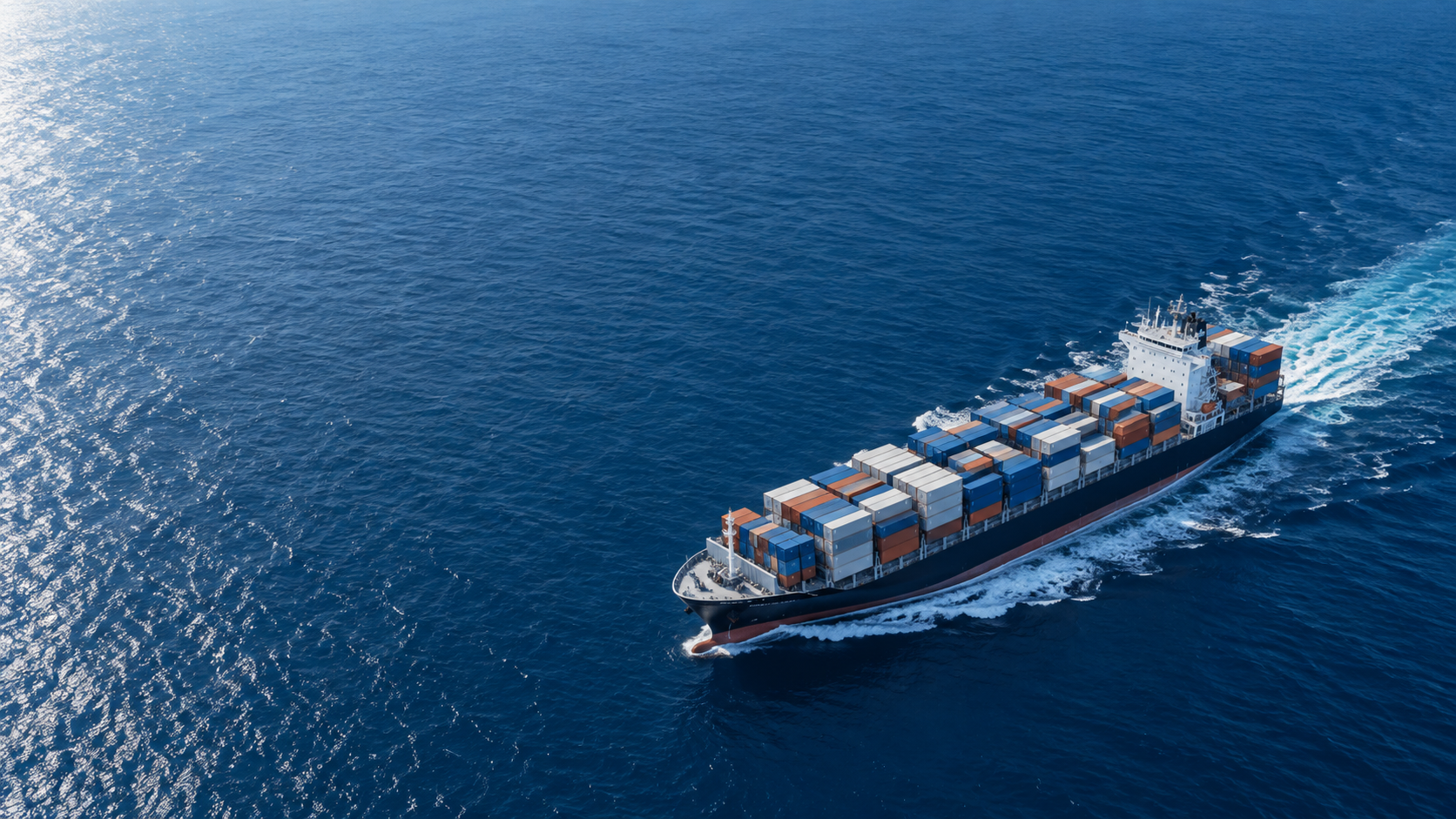 Container vessel carrying freight across open ocean